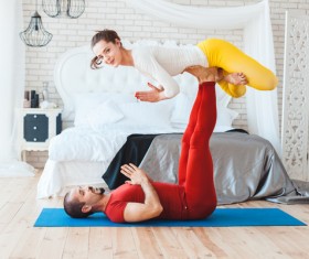 Men and women practicing yoga at home Stock Photo 15