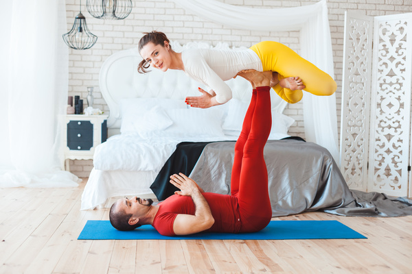 Men and women practicing yoga at home Stock Photo 15