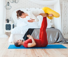 Men and women practicing yoga at home Stock Photo 16