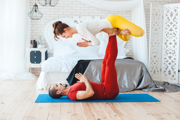 Men and women practicing yoga at home Stock Photo 16