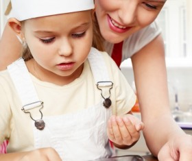 Mother and daughter making pastry together Stock Photo