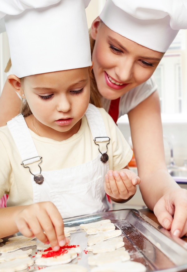 Mother and daughter making pastry together Stock Photo