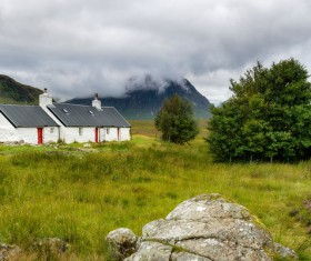 Mountain country house under the mountain Stock Photo