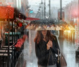 Rain umbrella walking woman Stock Photo
