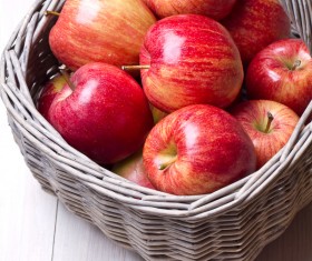 Red apple placed in the basket Stock Photo