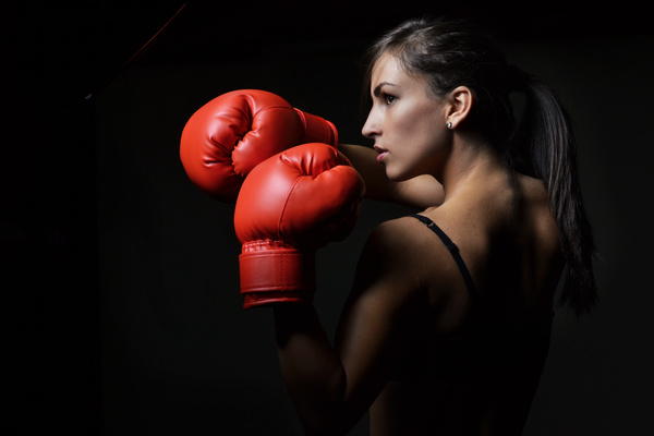 Red boxing gloves female boxer Stock Photo