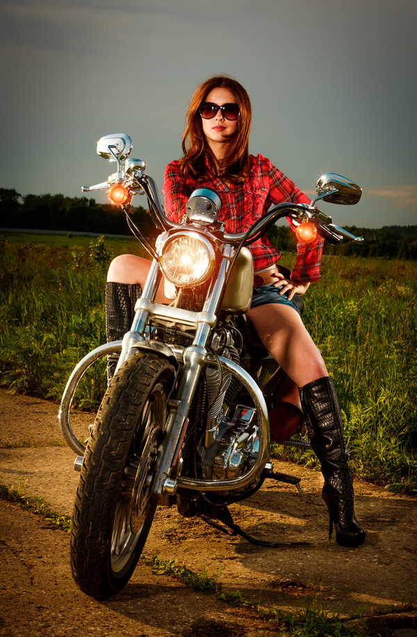 Riding a motorcycle handsome beauty Stock Photo