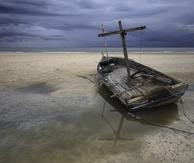 Seaside broken wooden boat Stock Photo