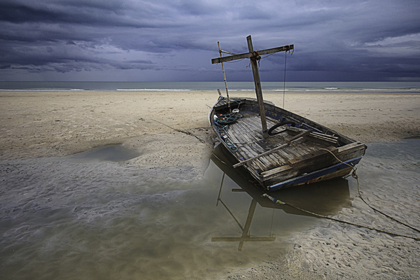 Seaside broken wooden boat Stock Photo