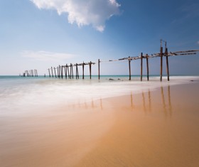 Seaside broken wooden bridge Stock Photo