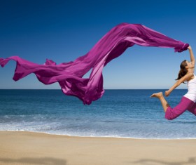 Seaside dancing woman with purple satin HD picture