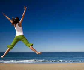 Seaside happy woman jump HD picture