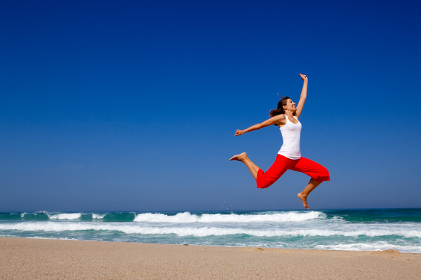 Seaside jumping woman HD picture