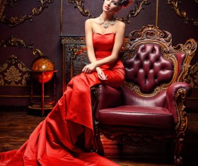 Sitting on the couch with red evening dress Stock Photo 01