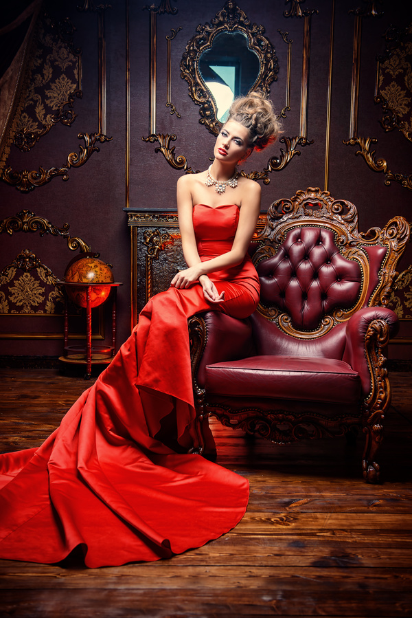 Sitting on the couch with red evening dress Stock Photo 01