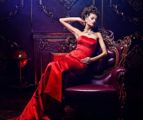 Sitting on the couch with red evening dress Stock Photo 02