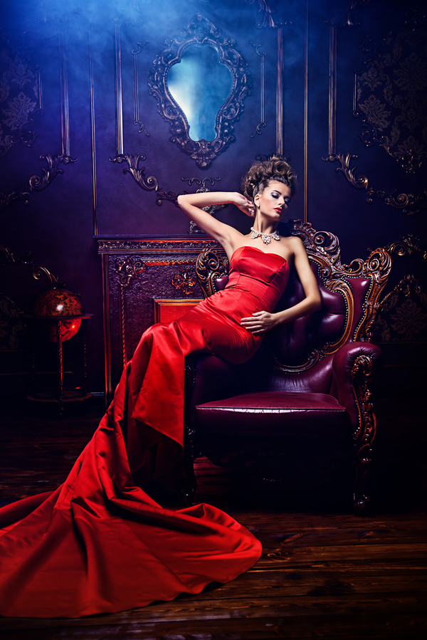 Sitting on the couch with red evening dress Stock Photo 02