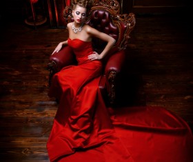 Sitting on the couch with red evening dress Stock Photo 03