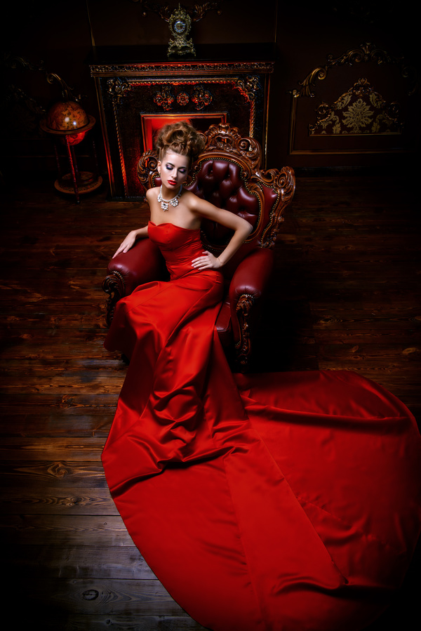 Sitting on the couch with red evening dress Stock Photo 03