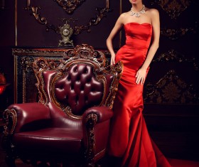 Sitting on the couch with red evening dress Stock Photo 04