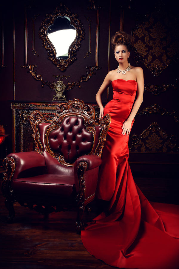 Sitting on the couch with red evening dress Stock Photo 04