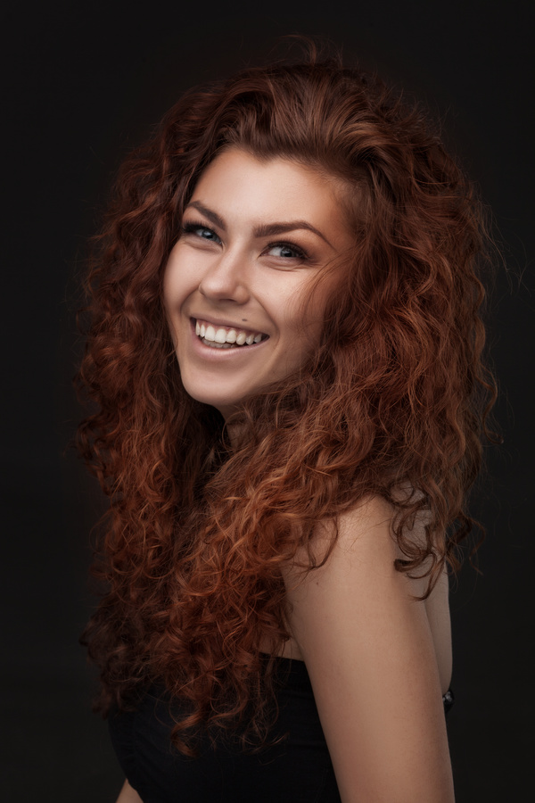 Smiling curly woman HD picture