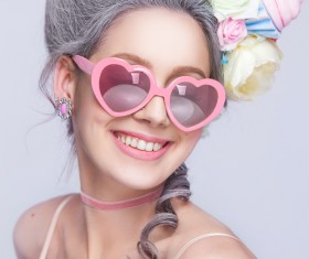 Smiling girl with heart glasses Stock Photo