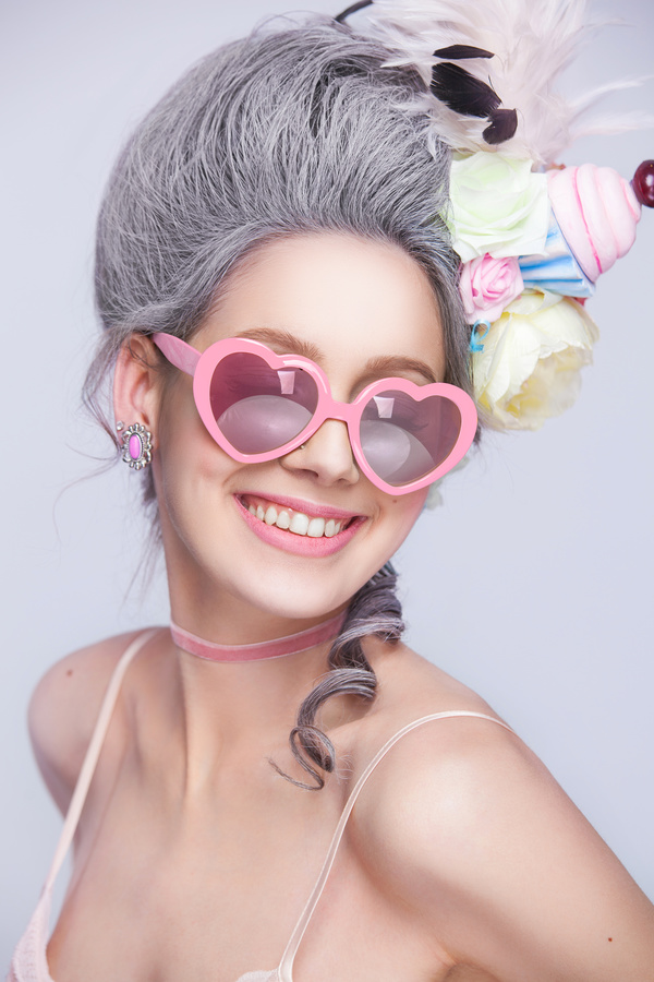 Smiling girl with heart glasses Stock Photo