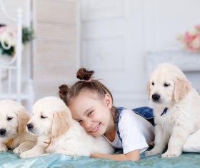 Smiling little girl with puppy Stock Photo