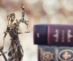 Statue of the goddess of justice and legal books Stock Photo 01