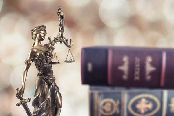 Statue of the goddess of justice and legal books Stock Photo 01
