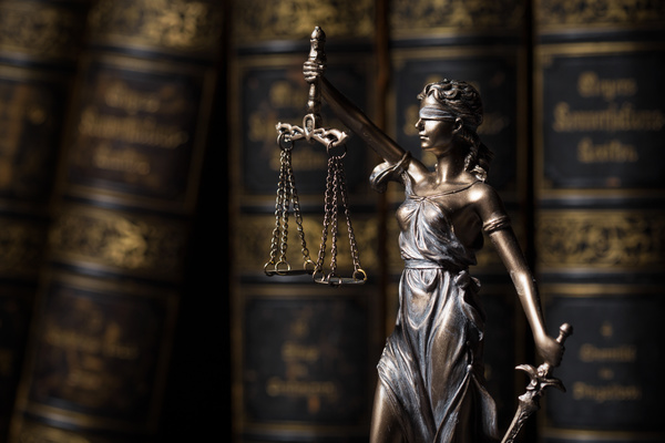 Statue of the goddess of justice and legal books Stock Photo 02