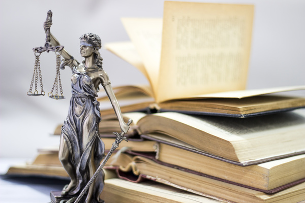 Statue of the goddess of justice and legal books Stock Photo 03
