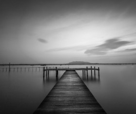 Sunset at the wooden dock black and white photo