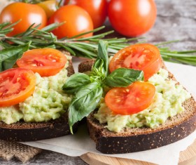 Tomato on black bread Stock Photo