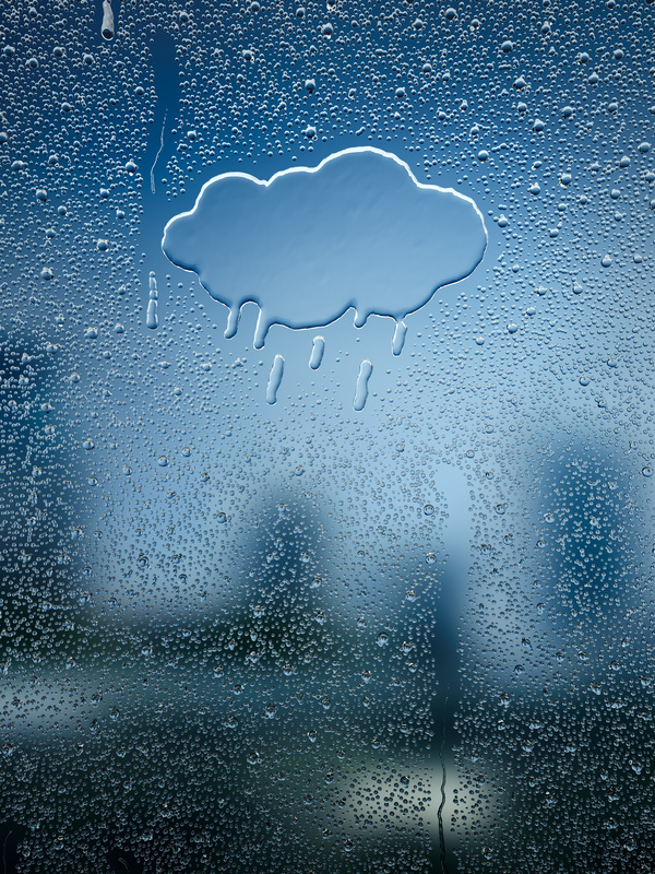 Water droplets and clouds on glass windows Stock Photo