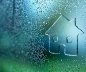 Water droplets on glass window with the sun Stock Photo