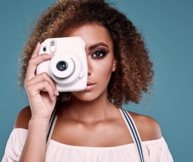 With a camera to take pictures of girl Stock Photo