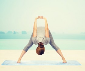 Woman doing stretching exercise Stock Photo