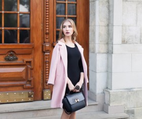 Woman dressed in a pink coat Stock Photo