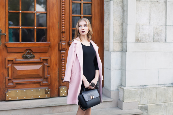 Woman dressed in a pink coat Stock Photo
