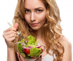 Woman eating salad Stock Photo
