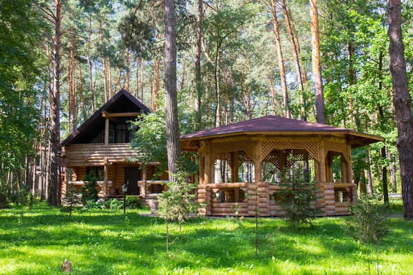 Wooden houses and pavilions in the forest Stock Photo