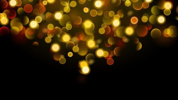Yellow bokeh effect with black background vector