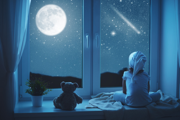 little girl looked at the night sky Stock Photo