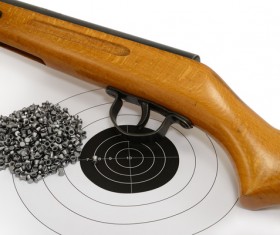 Air gun bullets and target paper Stock Photo