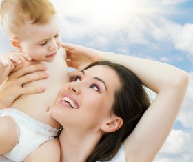 And mothers playing with babies Stock Photo