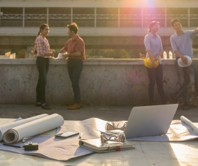 Architects and drawings on the ground Stock Photo