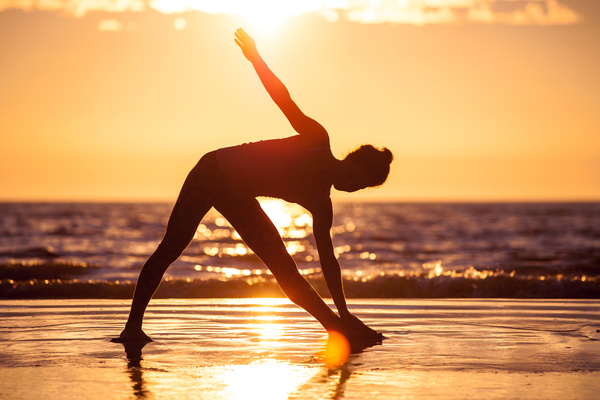 Backlight shooting sunrise beach practicing yoga woman Stock Photo 01