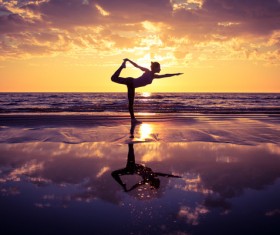 Backlight shooting sunrise beach practicing yoga woman Stock Photo 03